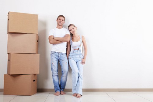 Professional packing team preparing fragile household items in West Hampstead