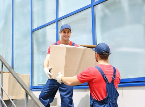 Local movers organising packed boxes in a West Hampstead property
