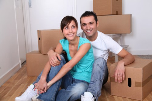 Same-day removals team loading items near a busy West Hampstead street