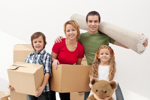 Loading household items into a van for a West Hampstead move