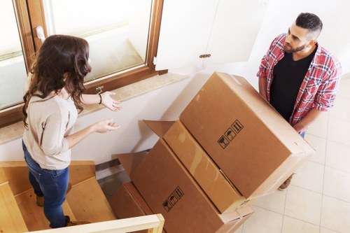 Packed household boxes and furniture ready for removals in West Hampstead