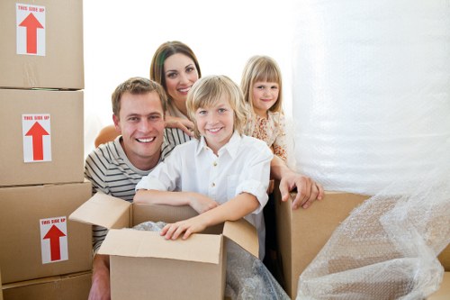 Furniture and boxes being moved with a removal truck in West Hampstead