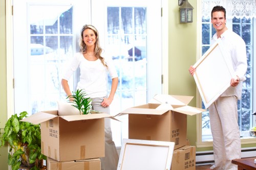 Packed boxes and furniture ready for urgent collection from a West Hampstead flat