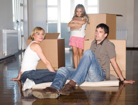 Packing and wrapping household items for a move in West Hampstead